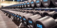 close up shot of eos branded dumbbells that go up to 150lbs