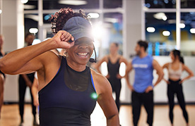 close up shot of class trainer getting everyone hyped up for their dance class